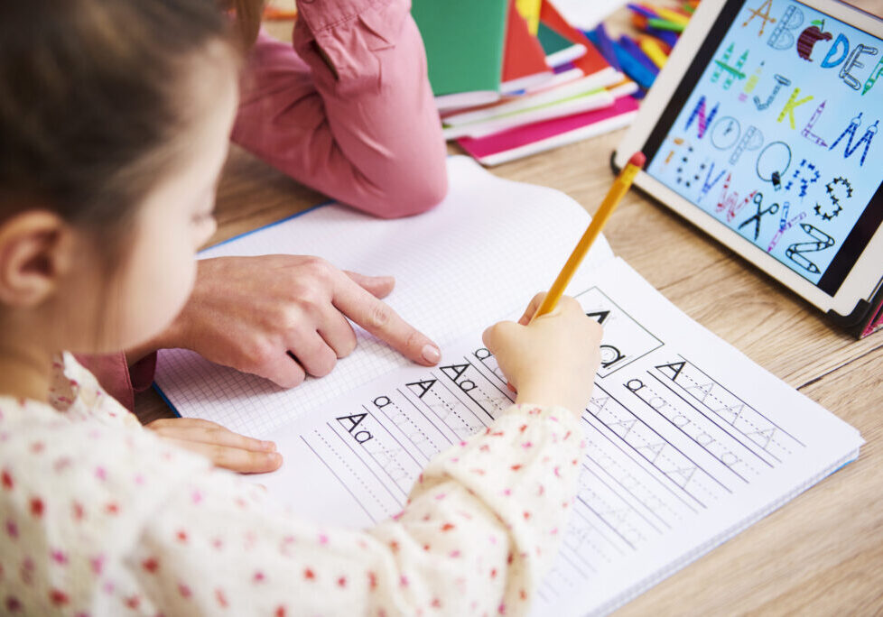 Close up of helping child with homework