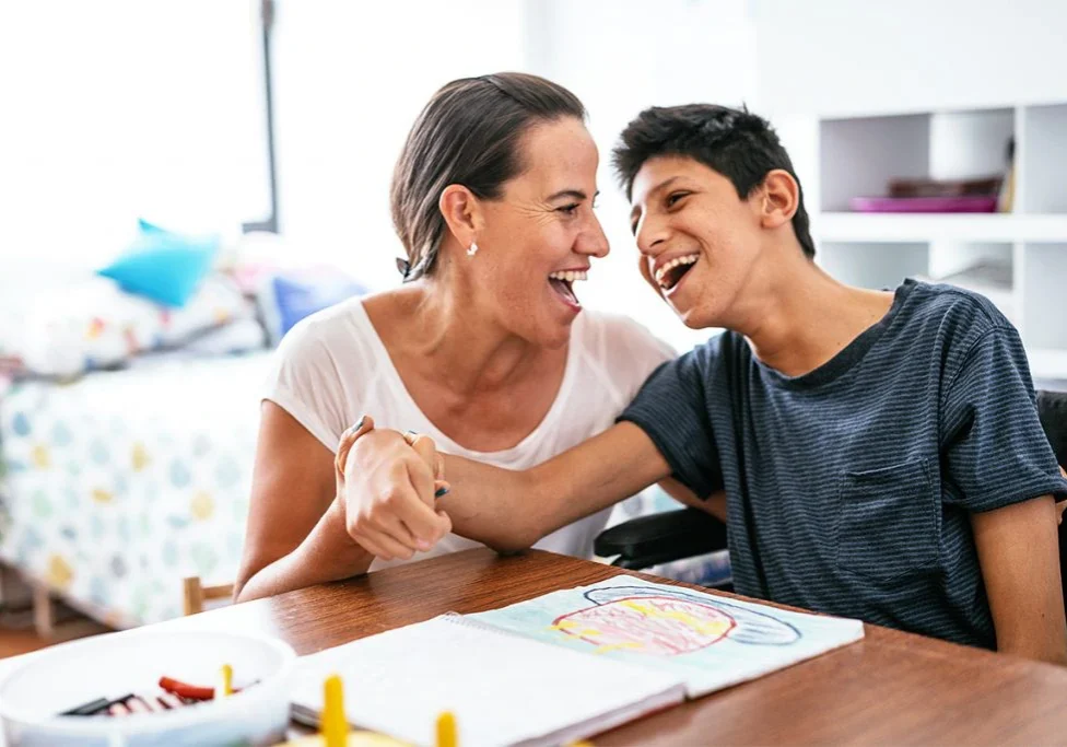 Photo of a special needs caregiver with her client